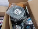 a cardboard box with a bunch of electronics inside of it