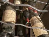 many bottles of wine that are in a metal rack