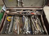 a box full of tools that are sitting on the floor