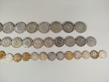 a lot of coins that are on the table