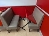 two chairs that are next to each other in a room