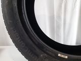 a close up of a tire on a white surface with a white background