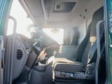 a view of the inside of a van with the driver ' s seat up