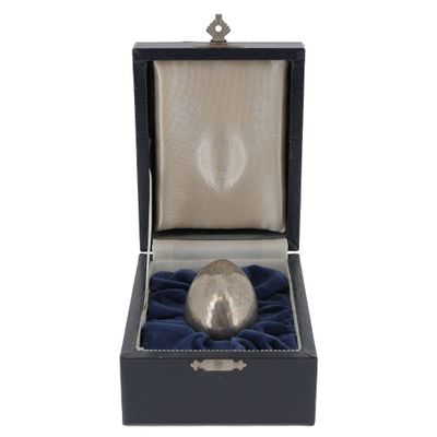 an image of a silver ball in a black box on a white background