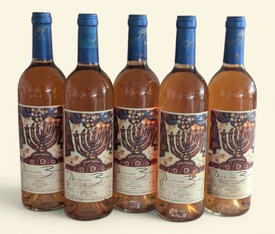 four bottles of wine with a menorah design on them