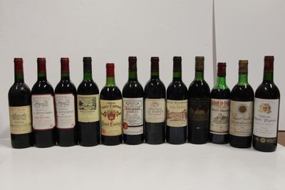 several bottles of wine are lined up in a row on a table