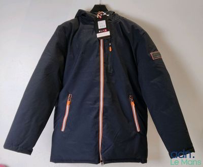 a close up of a jacket on a hanger on a wall