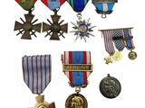 many medals and medals on display on a white background