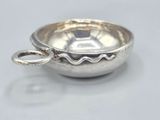 an image of a small silver bowl with a spoon in it