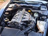 a car engine with the hood up and the hood down