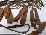 a lot of different types of leather items on the table