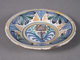 an image of a blue and yellow bowl with a flower design on it