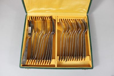 silverware in a yellow case with green trim and handles