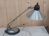 a lamp that is sitting on a table in a room