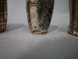 three vases that are sitting on a table