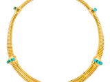 a gold necklace with turquoise stones