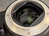 a camera lens sitting on top of a skateboard