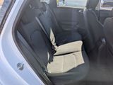the back seat of a car with a seat belt in the back of it