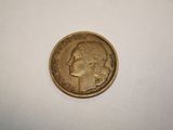 a close up of a coin on a white surface