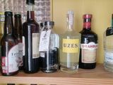 many bottles of alcohol on a shelf in a room