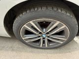 a close up of a tire on a white car