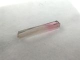 pink tourmaline crystal point on a white background