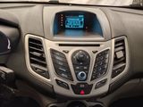 a dashboard of a car with a digital display