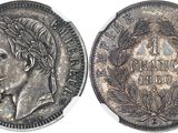 a close up of a silver coin with a woman ' s face