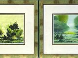 Deux tableaux représentant des arbres sont exposés dans un cadre accroché au mur.