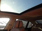 a view of a sunroof from inside of a car