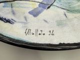 a plate with a painting of a bird on it