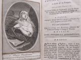 an open book with a picture of a woman holding a baby