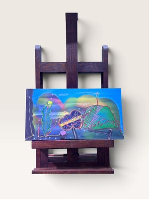 un tableau posé sur un chevalet en bois, sur lequel est posé un autre tableau