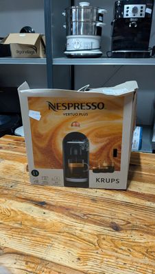 a box of nespresso coffee on a wooden table