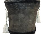 a black bucket with a white hat on it