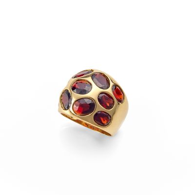 a gold ring with garnets and garnets on a white background