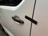 a close up of a car door handle with a sticker on it