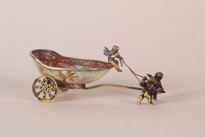 figurine représentant un homme tirant un bateau avec un chien en laisse