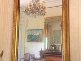 a large mirror hanging on the wall in a room