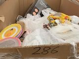 a cardboard box full of assorted items in a store