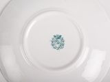 the plate is white with a green design on it