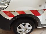 a white van with a red stripe on the side of it