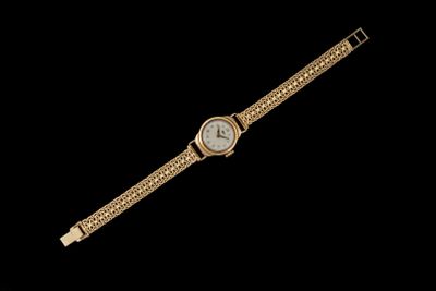 a gold wrist watch with a white face and a gold chain