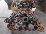 a box full of old metal parts on the floor
