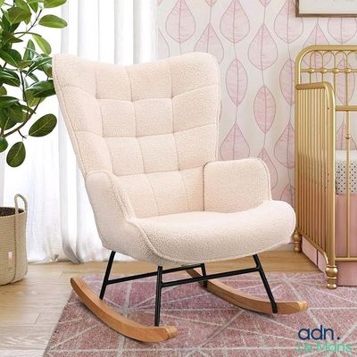 a rocking chair in the corner of a room next to a crib