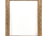 a gold picture frame on a white wall with a white background