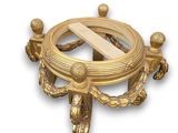 a gold plate with a cross in the middle of it