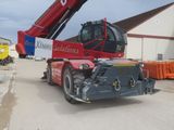 a red crane that is sitting on the back of a truck