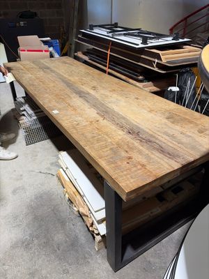 a large wooden table in the middle of a room