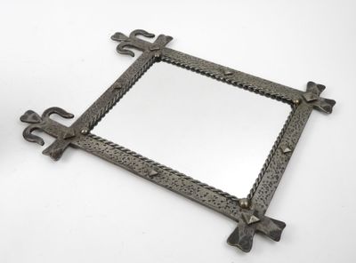 an image of a square mirror with a cross design on it